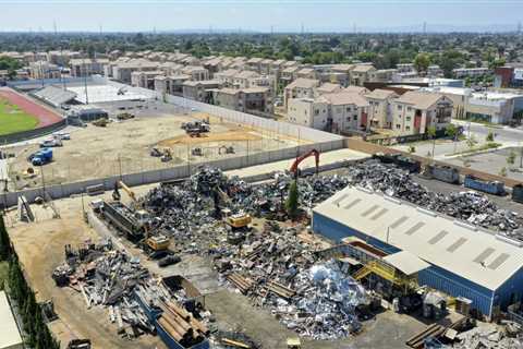 Police raid a metal recycling plant accused of endangering Jordan High students, neighbors